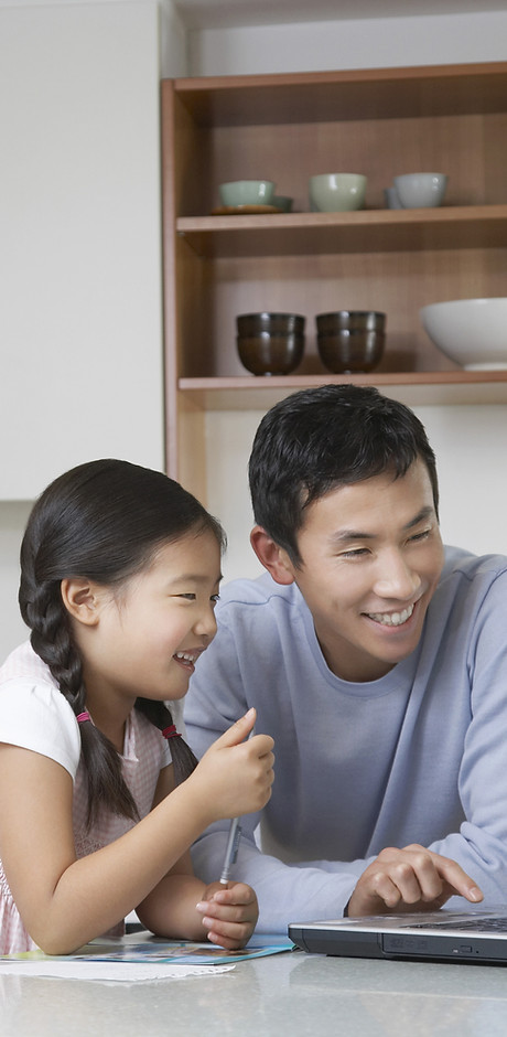 Father and daughter at computer
