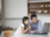 Father and daughter at computer
