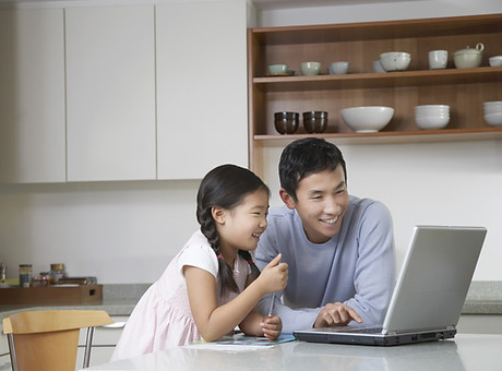 Father and daughter at computer