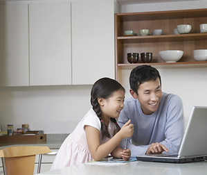 Father and daughter at computer