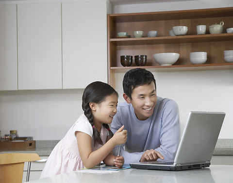 Father and daughter at computer