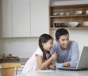 Father and daughter at computer