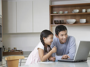 Father and daughter at computer