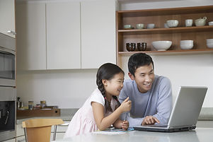 Father and daughter at computer