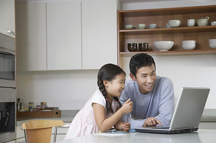 Father and daughter at computer