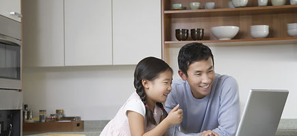 Father and daughter at computer