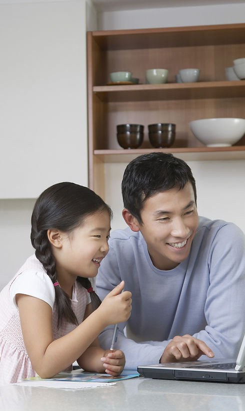 Father and daughter at computer