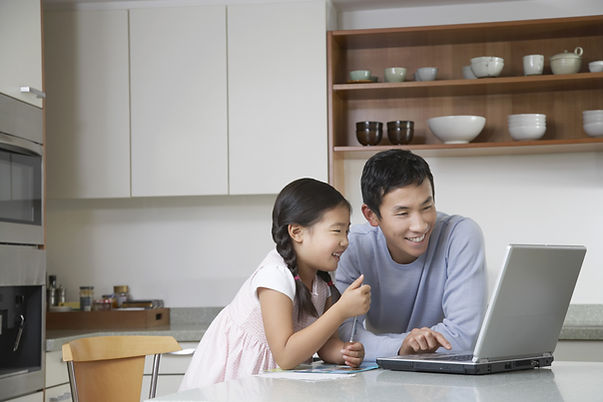 Father and daughter at computer