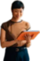 Focused professional woman using a digital tablet for work.