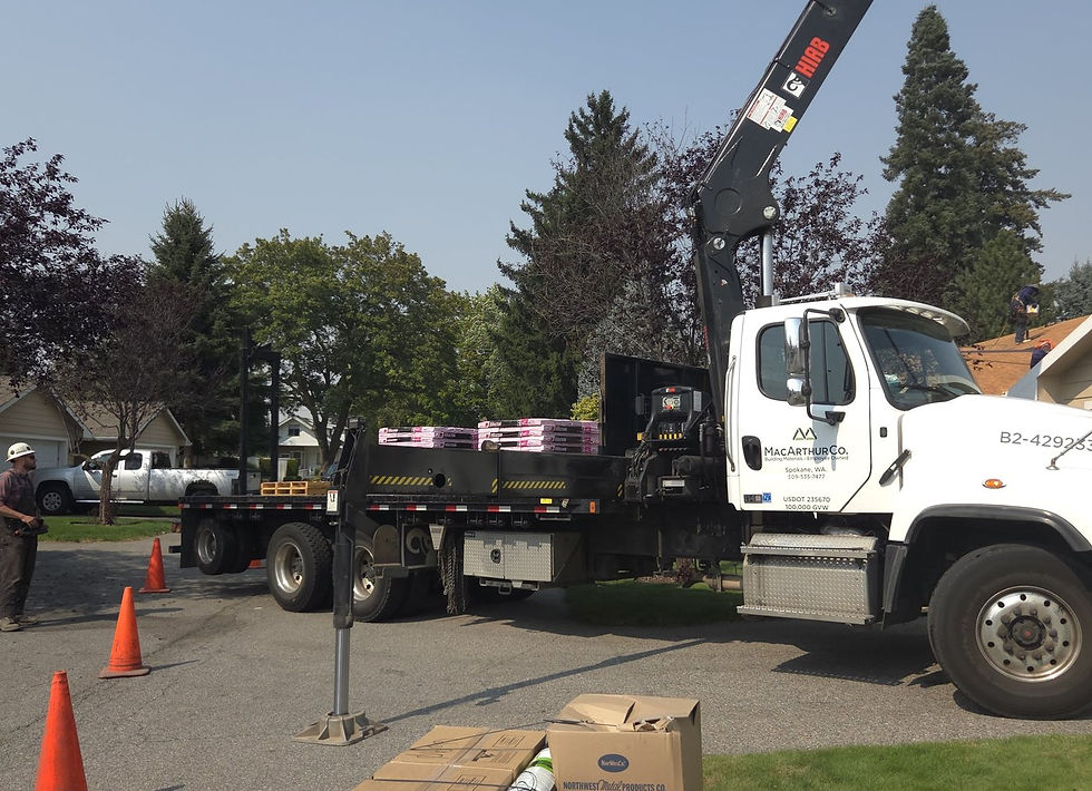 Boom Truck Delivering Shingles by First Rate Roofing Services