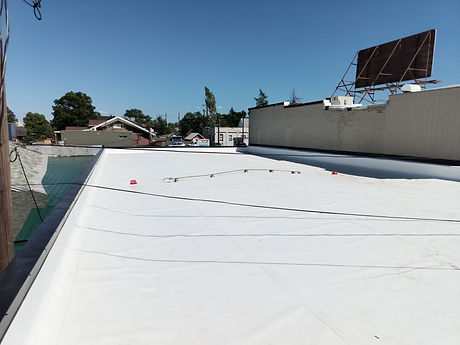 Finished commercial reroof by First Rate Roofing Services