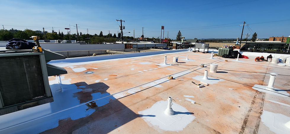Downtown Roof Coating, During by First Rate Roofing Services