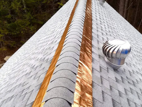 New shingle ridge with copper strips and roof vents