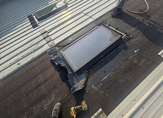 Skylight repair on a commercial metal roof