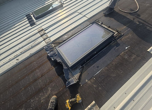 Skylight repair on a commercial metal roof