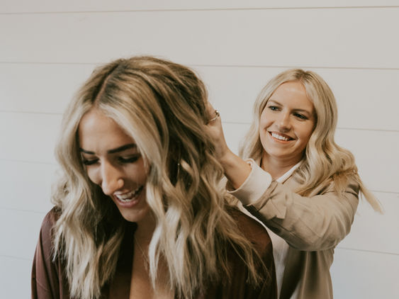 Hair stylist working with client