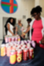 Associate producer, Laila Hoff, offering guests complimentary Poppi during Jenevesque Media's NBFF welcome mixer on July 22, 2026 | Photographed by Zion Laster