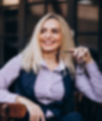 elderly-businesswoman-sitting-outside-cafe.jpg