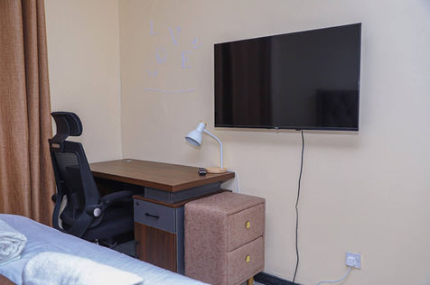 Bedroom workspace at Milimani ComfyHomestays Nakuru