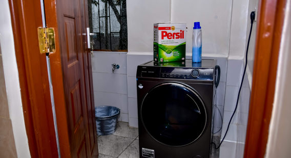 Laundry area with washing machine in Nakuru apartment