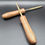Thumbnail: Handcrafted brass Pyro Tool with turned wooden handles – durable pyrotechnic and fuse insertion tools for professional fireworks technicians on black surface.
