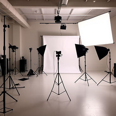 An open floor light photo studio, with a few equipment and white screen.jpg