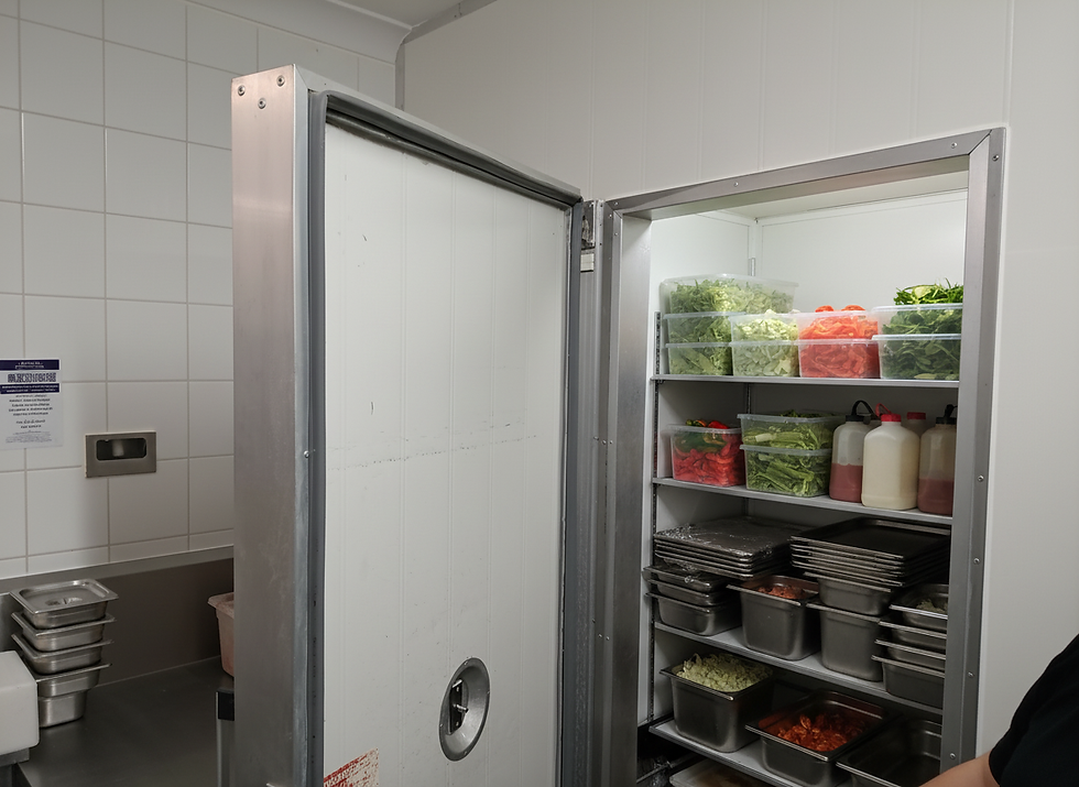 Close-up view of a commercial fridge door seal being inspected
