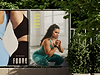 Women's activewear posters on fence