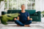 older woman practicing yoga for healthy aging, mobility, and overall wellness