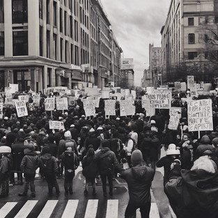 Protestors marching on a street