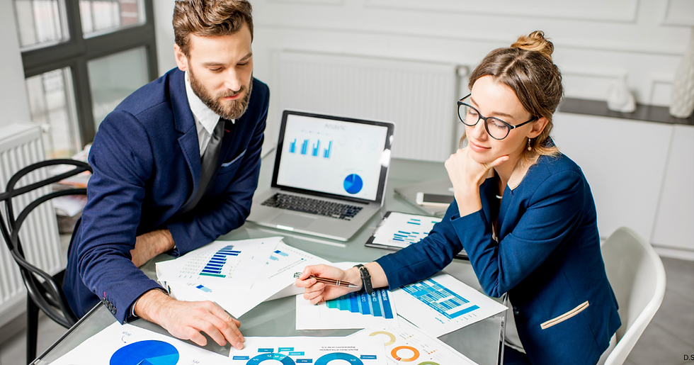 man and woman working together to develop marketing strategy