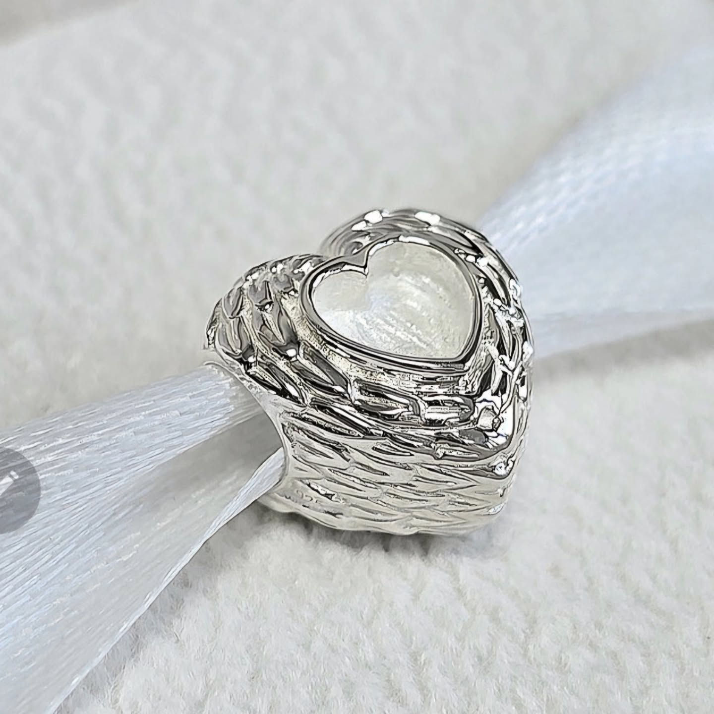 Feather heart charm