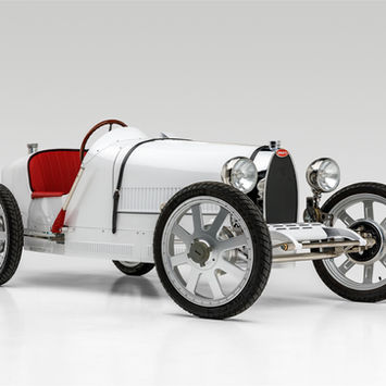 White Bugatti Type-style junior car photographed in a studio for Rennauto Brisbane.