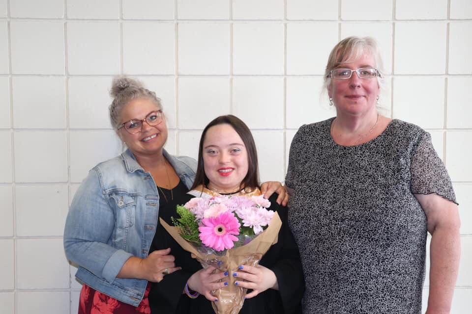 Lindsay (Center) at her high school graduation