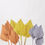 Thumbnail: Painted dried palm stems in orange yellow and lilac