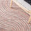 Thumbnail: A chair sitting on a blush colored contemporary area rug