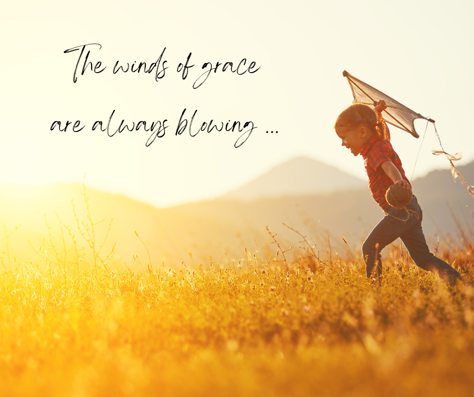 a child running through a field with a kite under the phrase: The Winds of Grace are Always Blowing