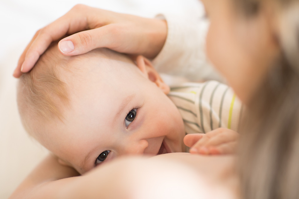 Happy breastfeeding baby