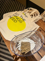 Tote bags with "All the things I need" and pencils