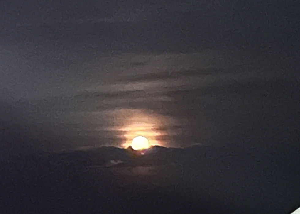 Moon rising over the ocean