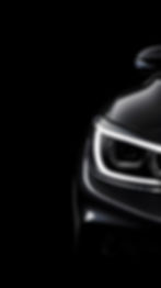 photo-front-view-led-headlights-modern-blue-car-black-background.jpg