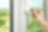 man-locks-unlocks-plastic-window-with-keys.jpg