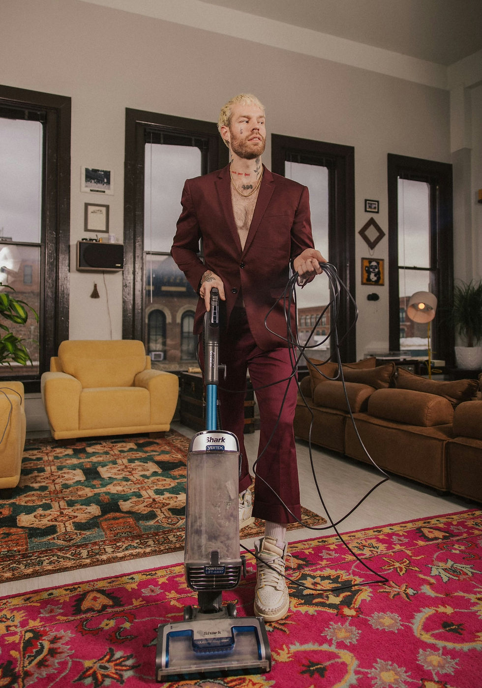 male model vacuuming