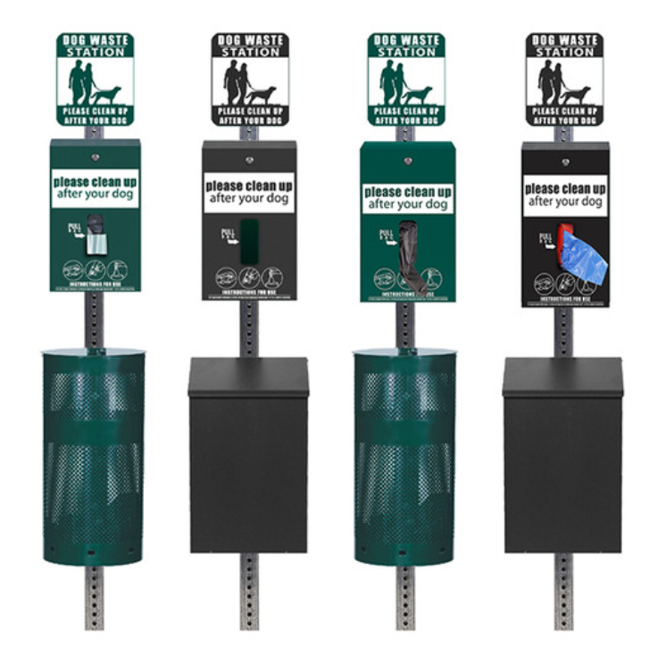 Four dog waste stations with green and black bins and signs reading "Please clean up after your dog." Display bags and graphics.