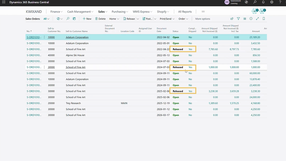 Business Central dashboard showing a list of sales orders. Statuses are highlighted: "Open" in green, "Released" in yellow boxes.