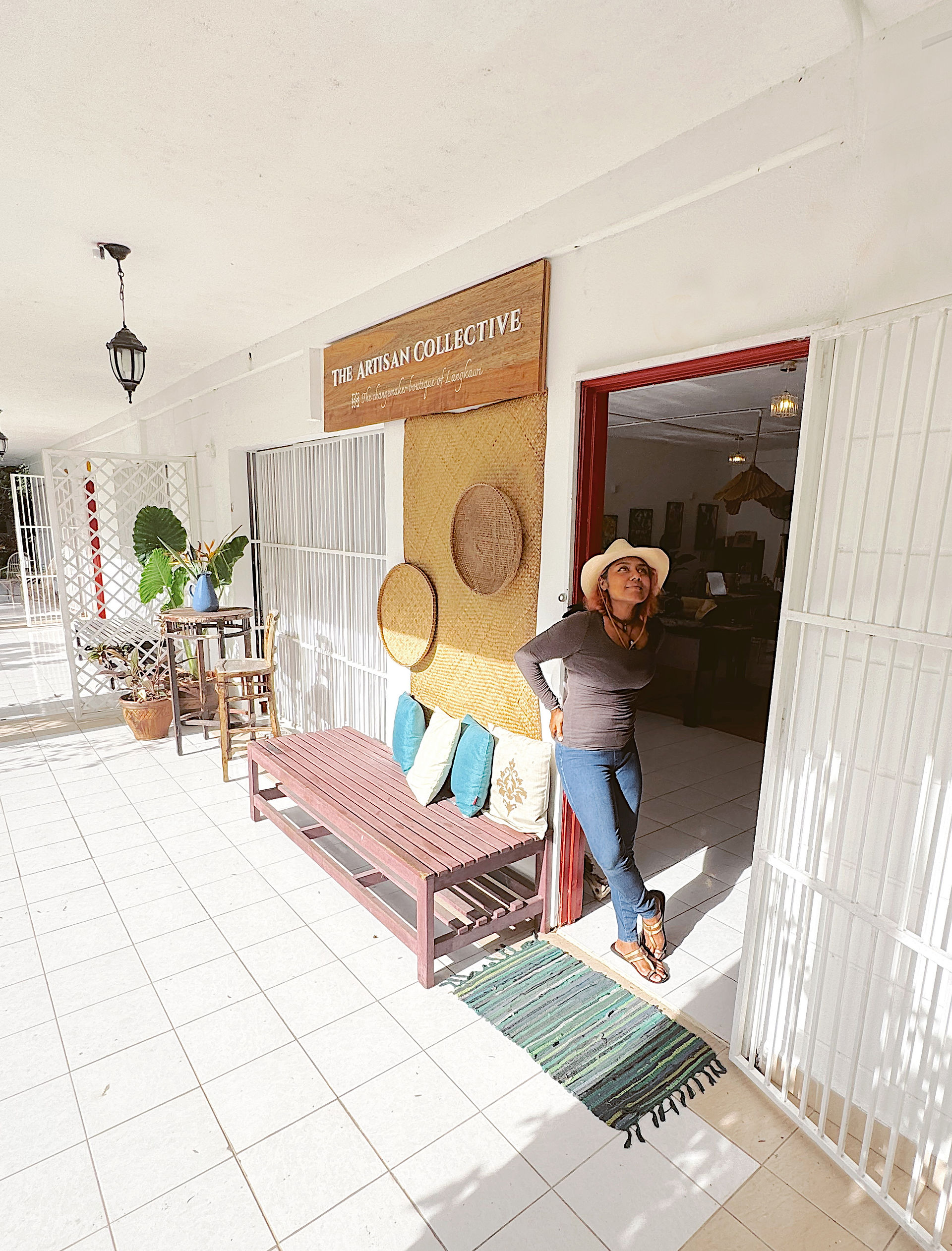 Woman standing at The Weaver's Collection shop entrance