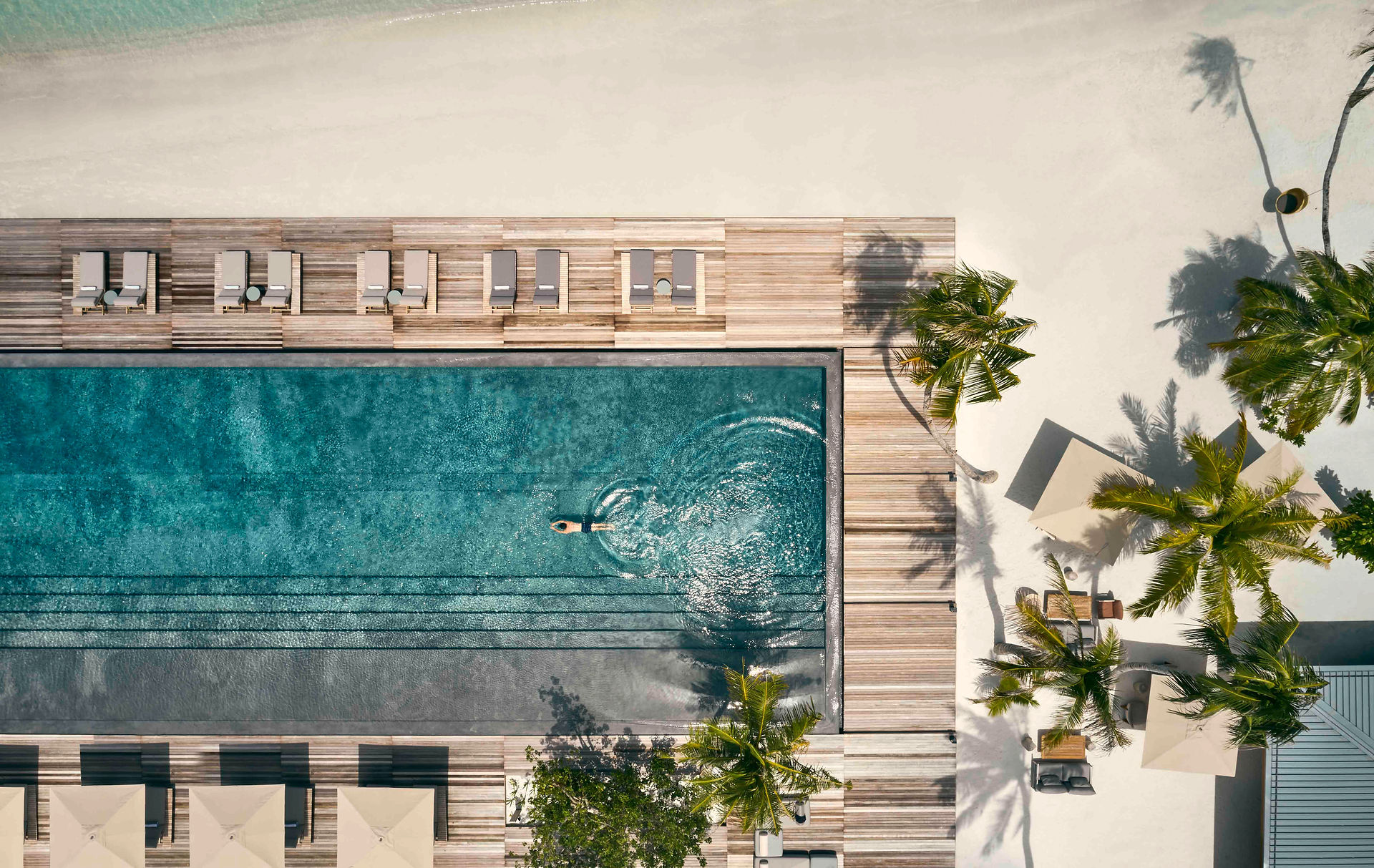 Person swimming in resort pool
