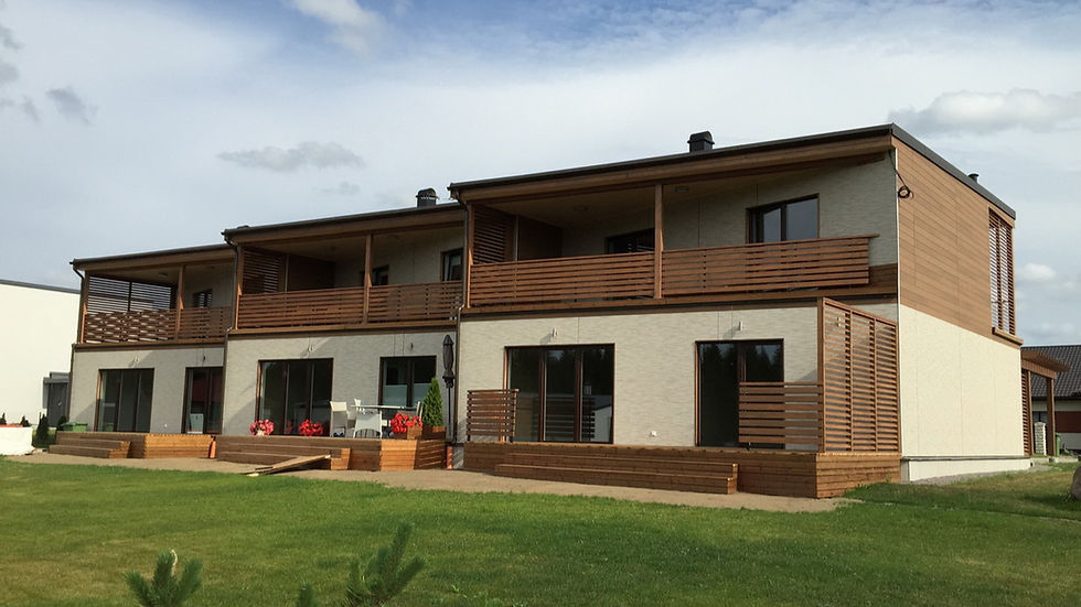 Wide exterior shot of a completed DeltaHouse prefab project — clean, confident, finished quality