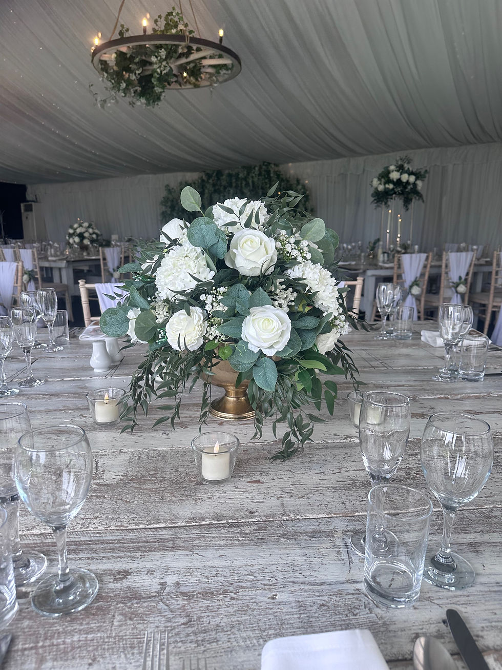 Thumbnail: Low floral arrangement in gold footed urn 