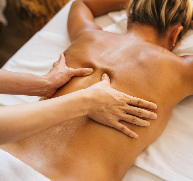 a-person-massaging-a-clients-bare-back-1024x683.jpeg